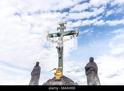 Statue of Jesus on cross with blue sky Stock Photo - Alamy
