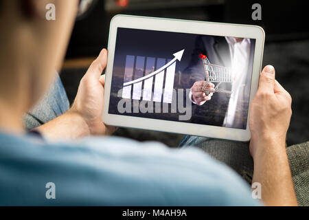 Statistics, analytics and financial report on tablet screen. Success and growth concept. Entrepreneur using business application. Stock Photo