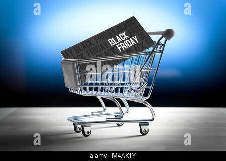Black friday concept. Grand sale after Thanksgiving. Online shopping, e commerce and internet store concept. Miniature shopping cart with www letters. Stock Photo