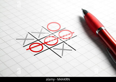 Tic tac toe game. Noughts and crosses. Paper and pen. Winning and success concept. Stock Photo