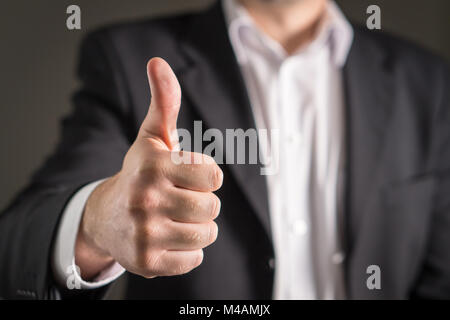 Business man showing thumbs up. Stock Photo
