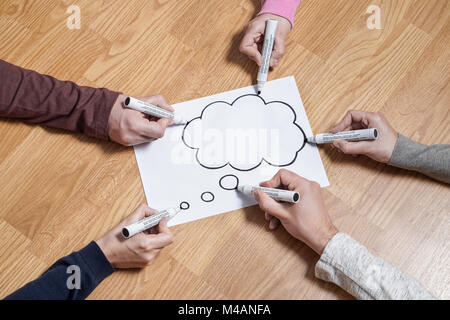 Thinking speech bubble balloon  and thought cloud. Brainstorming new ideas together for marketing plan or school project. Teamwork, synergy, education Stock Photo