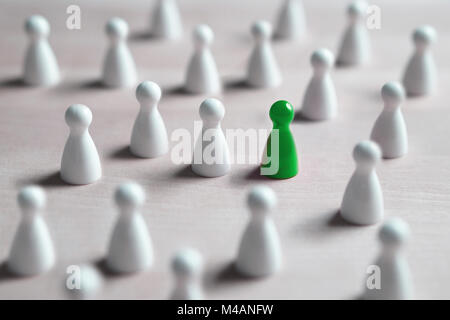 One different board game pawn. Individuality, independence, leadership and uniqueness concept. Stand out from the crowd. Think outside the box. Stock Photo
