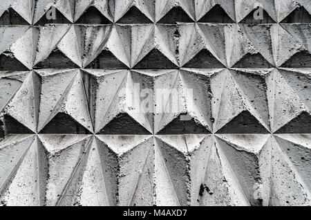 Black and grey mosaic tiles laid out in a geometric cube pattern. Stock Photo