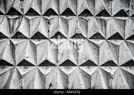 Black and grey mosaic tiles laid out in a geometric cube pattern. Stock Photo