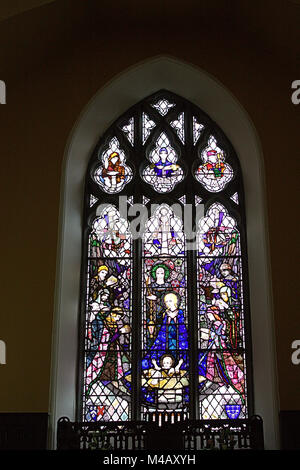 Stained Glass window of the Nativity by Harry Clarke in a small West Cork village church. Stock Photo