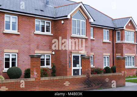 Brick built building which has experienced the effects of salt / salts drying on the surface of the bricks / brickwork, known as efflorescence. (94) Stock Photo