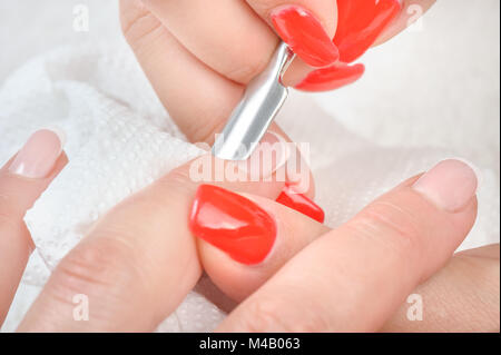 Cuticles care with cuticle pusher Stock Photo