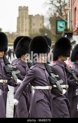 Soldiers of the Grenadier Guards during Changing of the Guard ceremony at Windsor Castle, UK. The Grenadier Guards have just handed over guard duty. Stock Photo