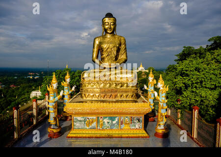 A golden Buddha statue on top of Sagaing Hill Stock Photo