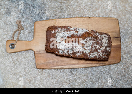 homemade loaf of bread at a sheepskin Stock Photo