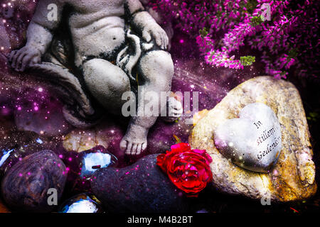Grave decoration in autumn with heart Stock Photo