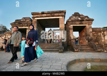 Muslim family visiting the Ratu Boko Palace compound. Special Region of Yogyakarta, Java, Indonesia. Stock Photo