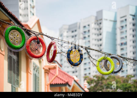 Traditional street decoration in Little India in contrast to the modern high rises in Singapore Stock Photo