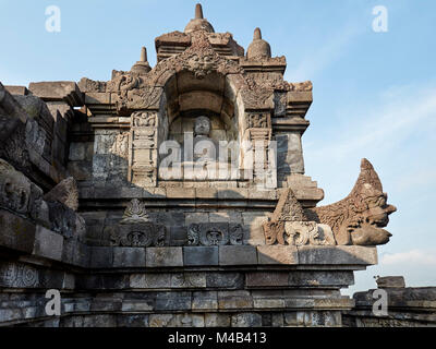 Buddha statue in a niche in Borobudur Buddhist Temple. Magelang Regency, Java, Indonesia. Stock Photo