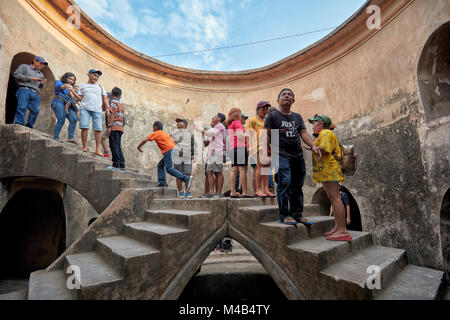 People in Gumuling Well (Sumur Gumuling), one-storeyed circular structure, once used as a mosque. Taman Sari Water Castle, Yogyakarta, Java, Indonesia Stock Photo