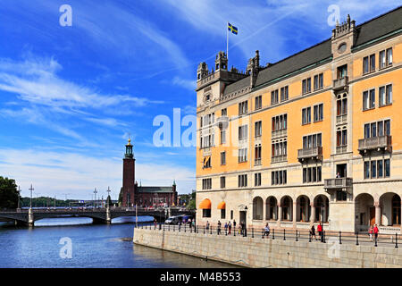 Stockholm / Sweden - 2013/08/01: Norrmalm district view from Old town quarter Gamla Stan - Stromgatan street with city hall in the background Stock Photo