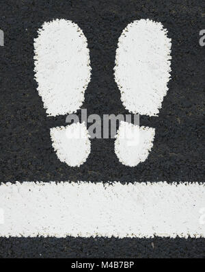 white pedestrian crossing with footprint road markings feet Stock Photo ...