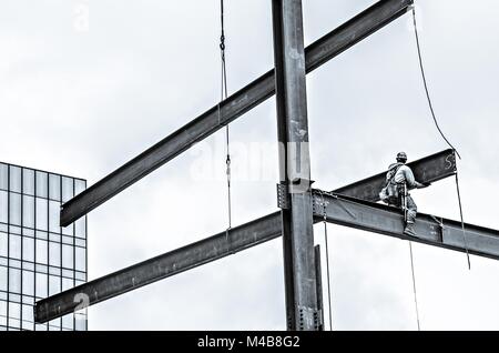 construction worker working on highrise building Stock Photo