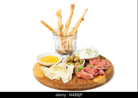 Assorted cheeses, wallnuts and other snacks Stock Photo