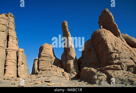 Algeria. Near Djanet. National Park Tassili n'Ajjer. Tassili Plateau. UNESCO World Heritage site. Sahara desert. On top Man of Tuareg tribe. Nomad. Stock Photo