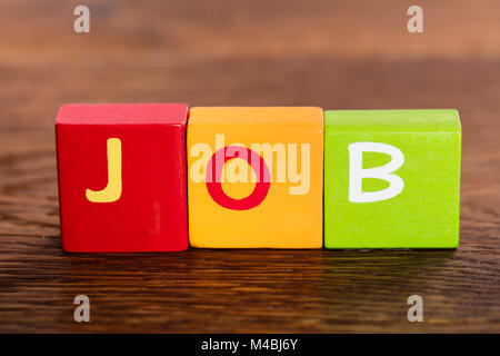 Job Word Made With Building Colorful Blocks On Wooden Table Stock Photo