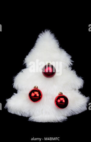 White fur christmas tree isolated on black background Stock Photo