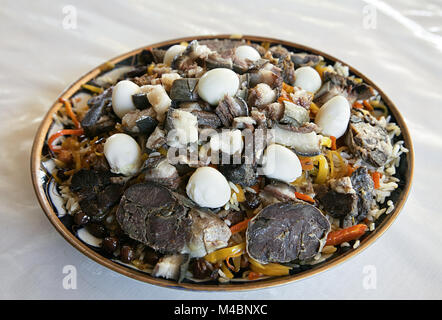 Uzbek national dish pilaf on a plate Stock Photo