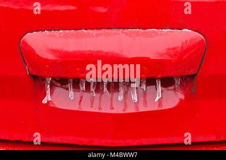 Icicles and frost on the tailgate of the car Stock Photo