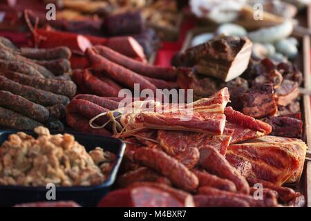 Sale of homemade sausages, salami and other meat products Stock Photo