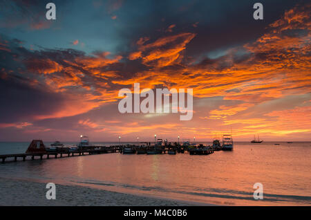 the Golden hour with  sail boats on sea anchored Stock Photo