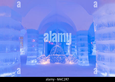 Inside Sorrisniva ice igloo hotel with blue colors and ice sculptures Stock Photo