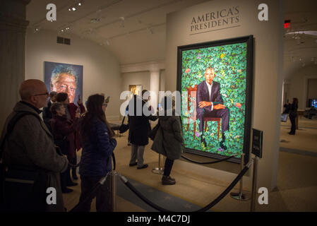 Washington, USA. 14th Feb, 2018. Crowds flock to see the new offical presidential portrait of Barack Obama at the National Portrait Gallery, Smithsonian Institution, Washington, DC. The painting, by Kehinde Wiley, was unveiled February 12, 2018. Credit: Tim Brown/Alamy Live News Stock Photo