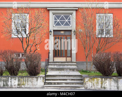 Symmetrical entrance facade with small front garden in an apartment block in the district Bislett in Oslo Norway Stock Photo