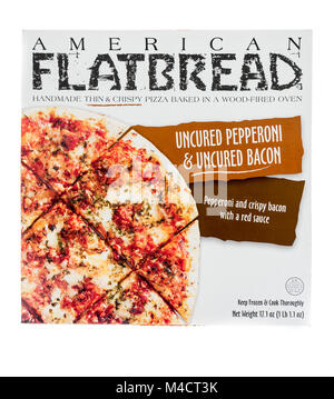 Winneconne, WI - 10 February 2018: A box of American Flatbread thin crust pepperoni and bacon pizza on an isolated background. Stock Photo