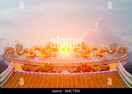 Beautiful chinese dragon statue with sun light background. Stock Photo