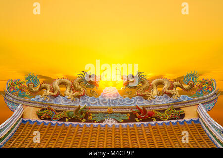 Beautiful chinese dragon statue with sun light background. Stock Photo