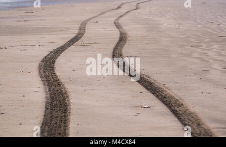 Long Jeep Tire Tracks on the beach Stock Photo