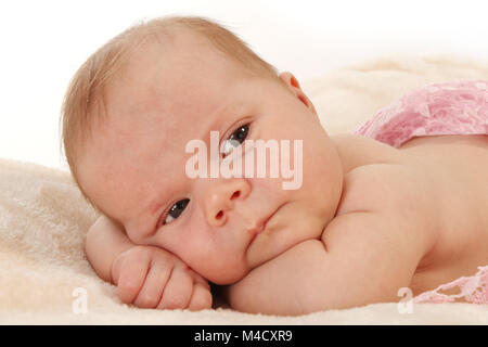 Newborn baby girl relaxing in nursery, beautiful new baby relaxed and happy Stock Photo