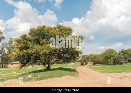 EXCELSIOR, SOUTH AFRICA, FEBRUARY 10, 2018: A farm scene with tractor at the Koranna Mountain near Excelsior, a small town in the Free Strate Province Stock Photo