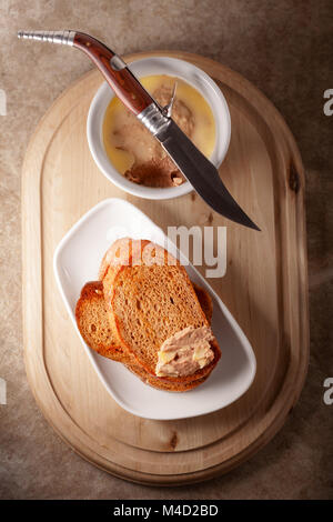 Home made chicken liver pate served with fried bread. Stock Photo