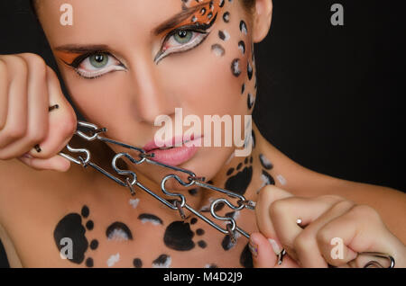 young woman with an animal face art and spines Stock Photo