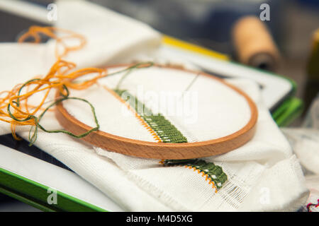 Work in progress. Embroidery on the linen fabric Stock Photo