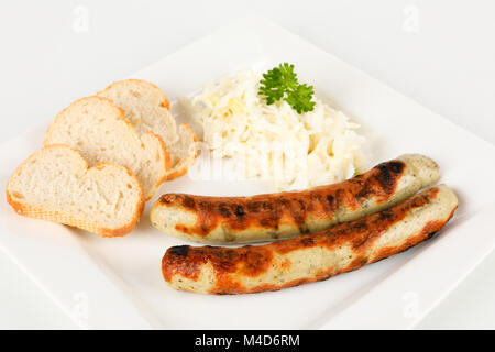 grilled sausages with bread and coleslaw Stock Photo