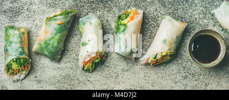 Vegan spring rice paper rolls with chopsticks, wide composition Stock Photo