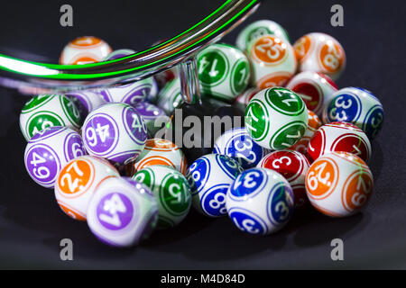 Colourful lottery balls in a machine Stock Photo