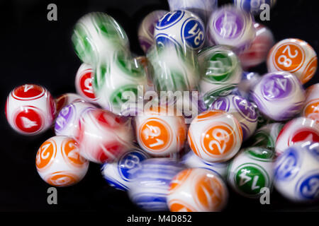 Colourful lottery balls in a machine Stock Photo