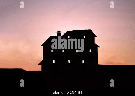 A large, spooky and mishapen building  silhouetted house aginast a redding sky at dusk. Stock Photo