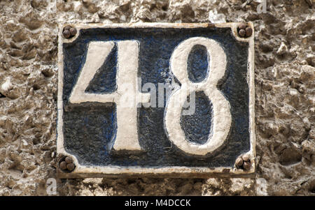 Old retro cast iron plate number 48 Stock Photo