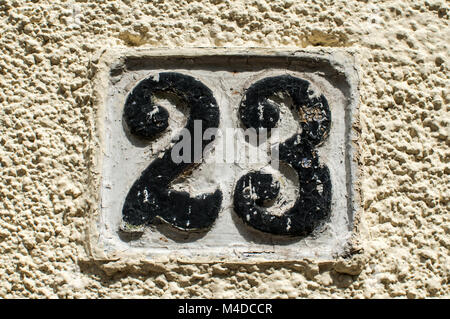 Old retro cast iron plate number 23 Stock Photo